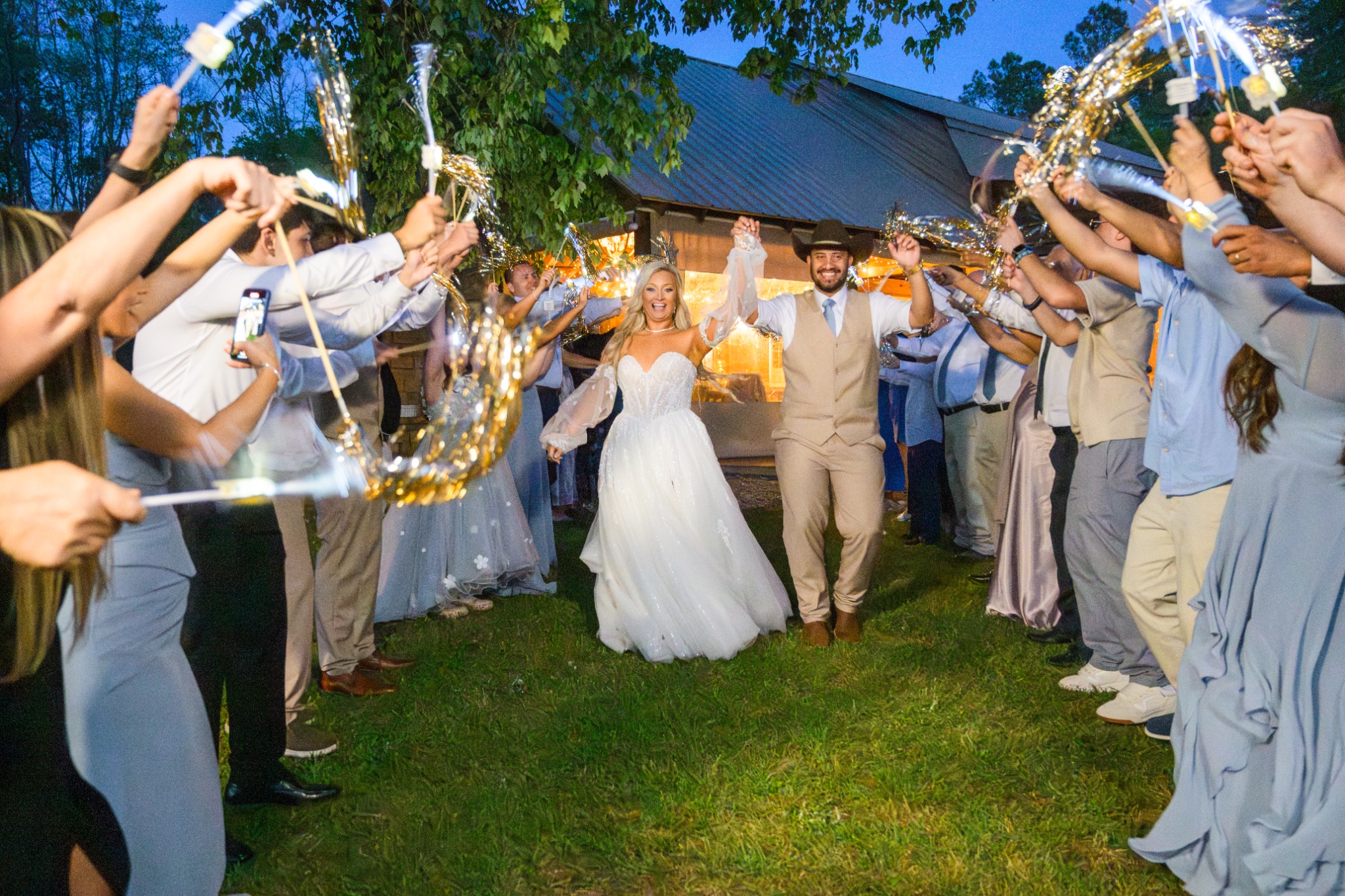 Newlyweds celebrating through a sparkler exit at Wildhorse at Parker Farms